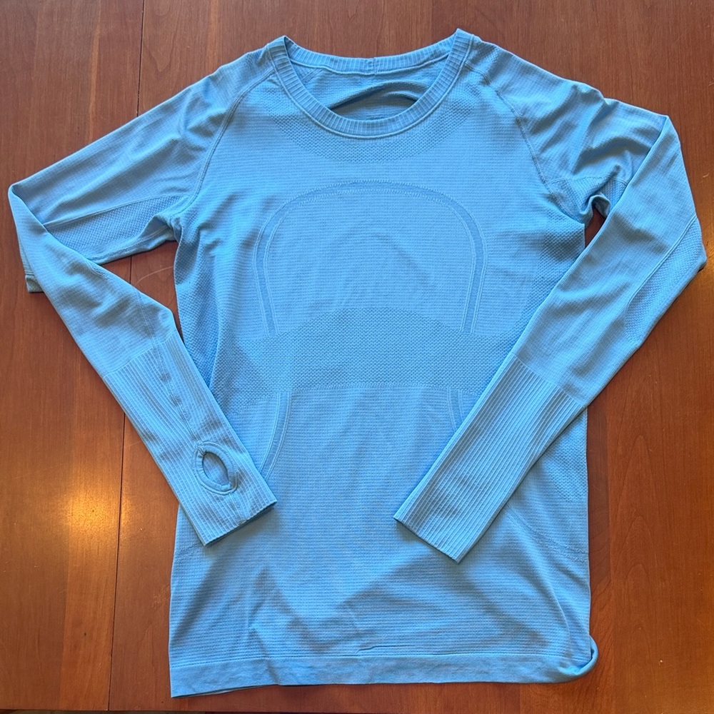 Lululemon Swiftly Long Sleeve sz 10. Crew neck. Thumbholes. Pretty blue color.
